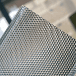 Honeycomb prismatic profile for UGR<19 LED lighting