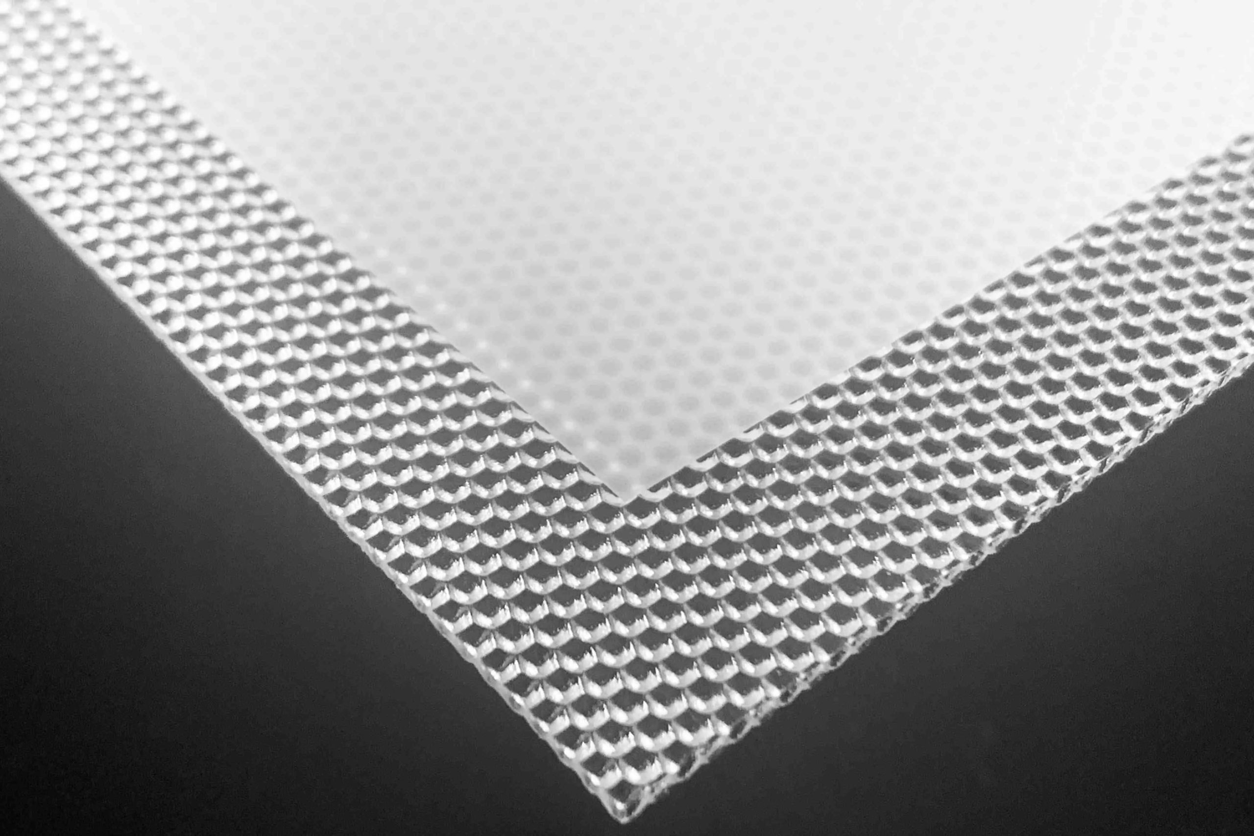 UGR prismatic optics combined with opto film for low-glare and uniform LED illumination