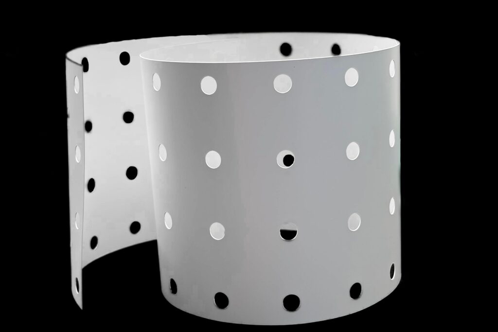 White reflector film roll with circular perforations for LED mounting